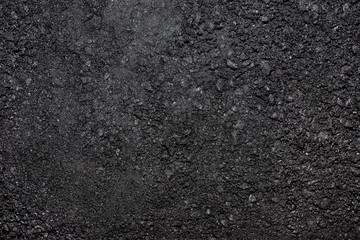 Texture made from a small pieces of coal, close-up shot.