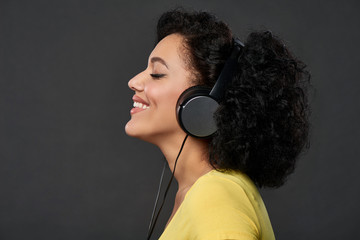 Profile of a woman listening music with closed eyes