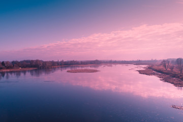 View from above of countryside and river et sunset. Nature landscape. Early spring
