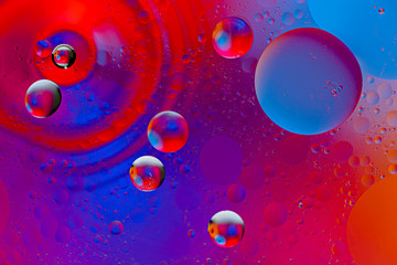 abstract space background of oil drops on the water surface