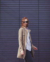 Fototapeta premium Outdoors portrait fashion woman model in trendy coat