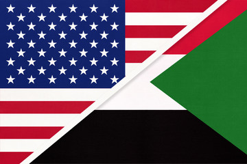 USA vs Sudan national flag from textile. Relationship between two american and african countries.