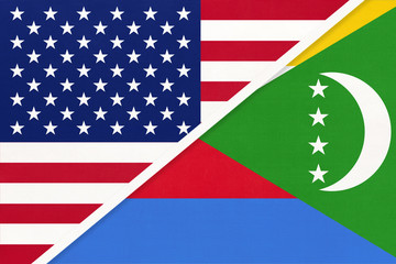USA vs Comoros national flag from textile. Relationship between two american and african countries.