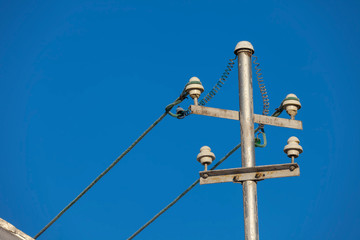 details of wires of electricity on pole. blue sky background