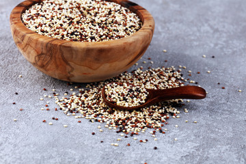 Set of quinoa Red, white and brown quinoa in a wooden spoon. healthy food