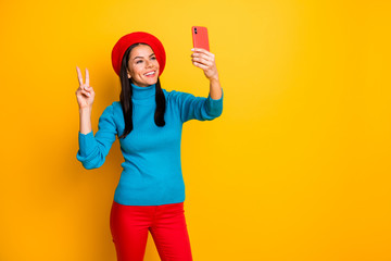 Portrait of her she nice attractive lovely cheerful cheery girl making taking selfie having fun showing v-sign enjoying trip weekend isolated over bright vivid shine vibrant yellow color background
