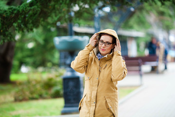 Modern stylish young woman outdoor in warm autumn day.