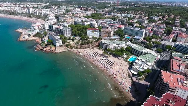 Spain, Salou city aerial view. Summer time fun in Spain. Many people on the sea beach. Summer time chilling