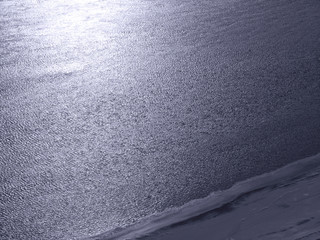  Blue abstract background. Toned classic blue background. Lake and coastline. Top view water...