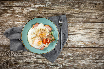 Fried eggs with pork ham.