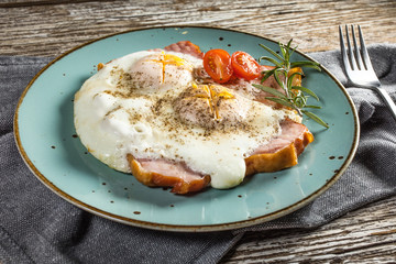 Fried eggs with pork ham.
