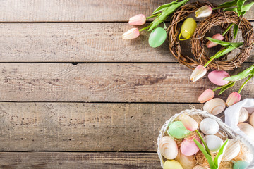 Spring Easter holiday. background. Zero waste Easter concept with traditional Easter decoration - eggs, flowers, branches, bunny. Eco friendly lifestyle, Above copy space
