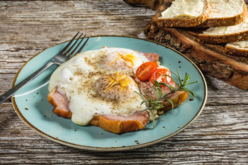 Fried eggs with pork ham.