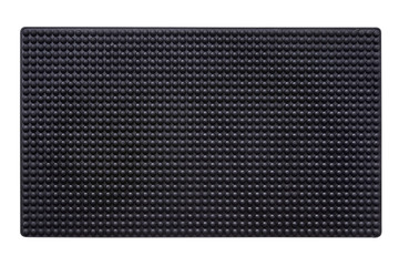 Black rubber entrance mat isolated on white background. Cellular rubber mat for dirt removal....