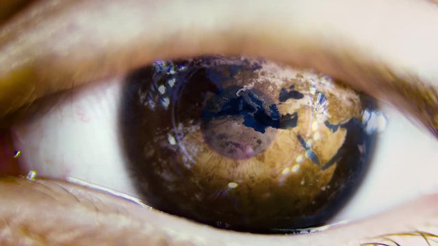 Close-up of planet earth in the ye of a child. View of a child on the environmental world.