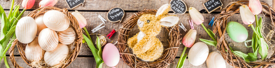 Spring Easter holiday. background. Zero waste Easter concept with traditional Easter decoration - eggs, flowers, branches, bunny. Eco friendly lifestyle, Above copy space