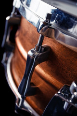 Close-up Drum set in a black background.