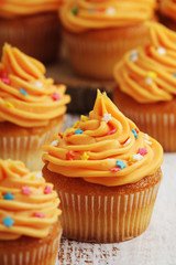 Cupcakes with orange icing on top