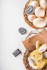 Spring Easter holiday. background. Zero waste Easter concept with traditional Easter decoration - eggs, flowers, branches, bunny. Eco friendly lifestyle, Above copy space