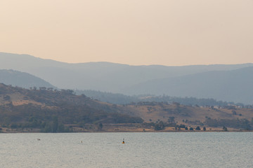 Lake Jindabyne and layer of mountains. NSW, Australia.