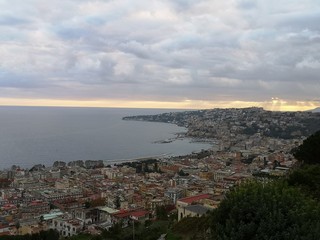 View of the city of Naples and the sea close to sunset time