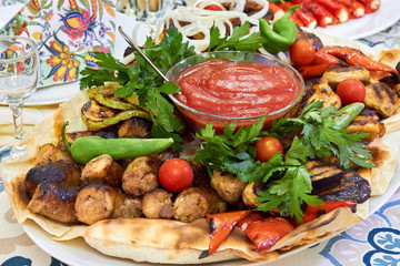 Fototapeta premium Assorted delicious grilled meat with vegetable in plate on table