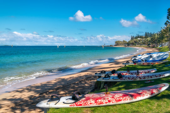 Windsurfing, sailing and paddling on the beach at Anse Vata Bay in Noumea, New Caledonia, French Polynesia, South Pacific Ocean.