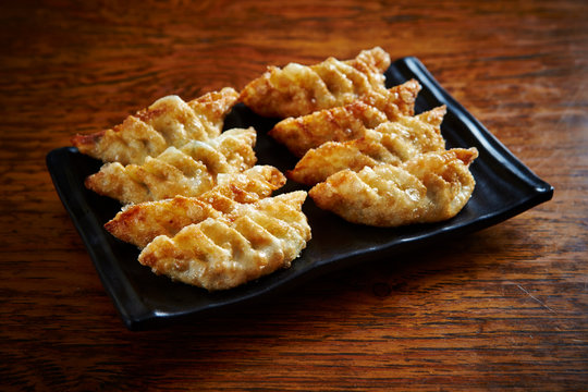 Deep Fried Dumpling On Black Plate 