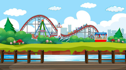 Scene with roller coaster and viking ship in the fun park