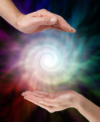 Creating a powerful Vortex Energy Field - male hand opposite female hand with a white spiralling...