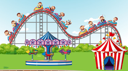 Scene with monkeys riding roller coaster in the park