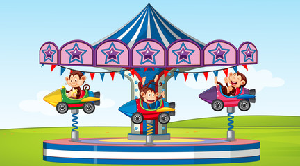 Scene with happy monkeys riding on rocket ride in the park