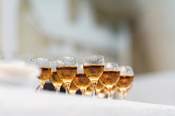 row of glasses with cognac