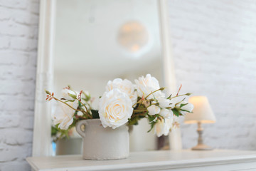 white rose bouquet in old pot