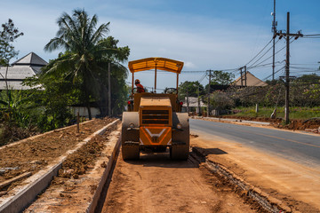 Road rollers working on the new roads construction site. Heavy duty machinery working on highway....