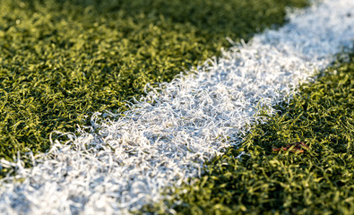 artificial grass on a football or soccer field - white line marking