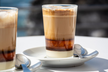 Special coffee of Canary islands, sweet barraquito coffee with layers and alcohol served in glass