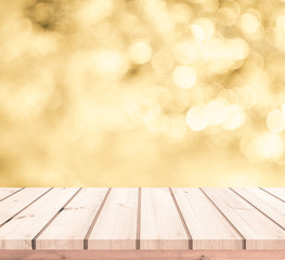 wooden table with gold bokeh background for products display