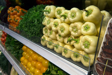 sale of sweet pepper, yellow tomatoes, lettuce, vegetable department, grocery store