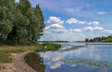 Fototapeta na wymiar Bright summer day in the Strelka of Yaroslavl Beautiful landscaping of the Park on the embankment of the Volga and Kotorosl in Yaroslavl