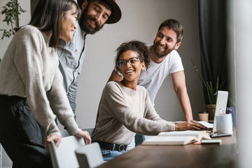 Image of multiethnic young business people working together at office