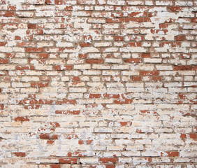 the brick is old painted and the paint