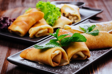 Delicious Tasty Homemade crepes or pancakes with raspberries and blueberries for breakfast