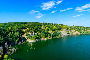 Beautiful lake in the abandoned granite quarry on summer