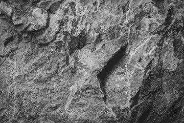 Abstract background of natural dark grey stone or rock (monochromatics)