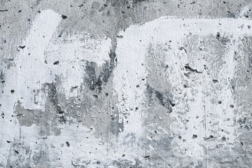Obraz premium Gray stained concrete wall, white painted wallpaper. Abstract art, urban background. Old vintage paper texture. Retro grey structure, architecture backdrop. Cement, stone wall surface.