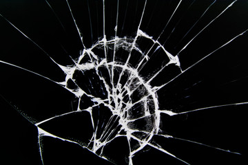 The texture of broken glass with cracks. Cracks on smartphone screen from impact. Concept for design.