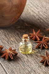 A bottle of essential oil with star anise