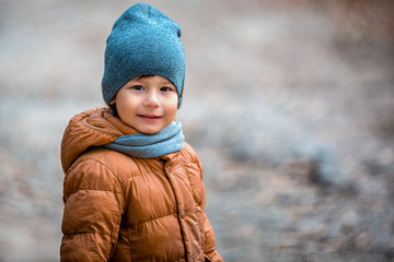 Portrait of a child outdoors. Happy little boy