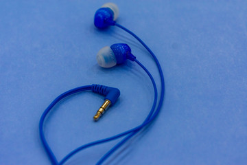 headphones on a blue background